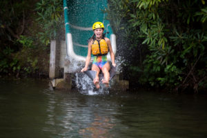 Girl going down water slide